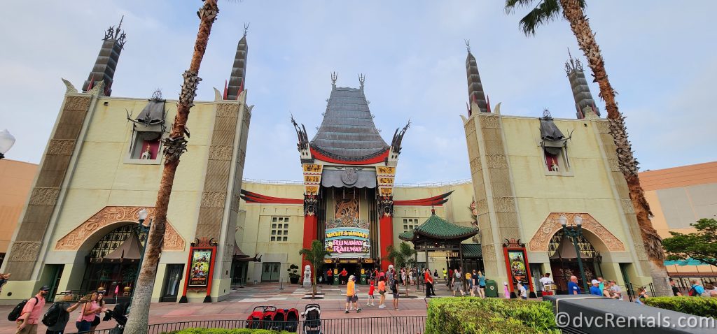 Exterior of the Chinese Theater in Disney's Hollywood Studios. People are walking in front of the building.