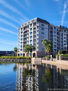 Exterior of Disney's Riviera Resort with a lake in front of it.