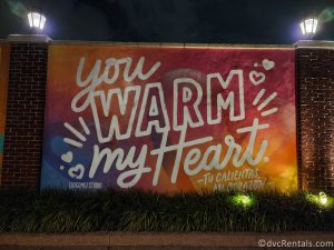 Mural in Disney Springs that reads "You Warm My Heart."