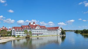 Exterior Shot of Disney's Grand Floridian Resort with the lake in front of it.