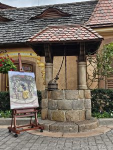 Wishing Well and painting of Snow White in the Germany Pavilion at Epcot.