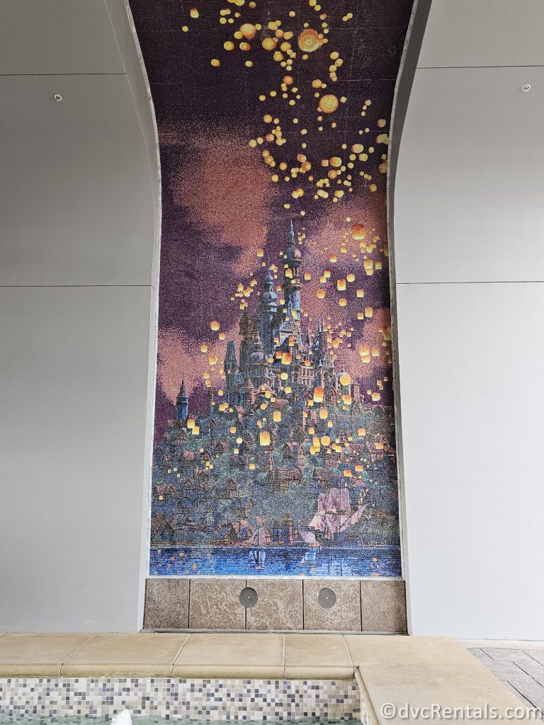 Mural of Rapunzel's lanterns flying over her kingdom in the walkway to the Skyliner from Disney's Riviera Resort.