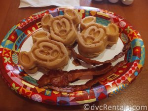 Mickey Waffles and Bacon on a Paper Plate.
