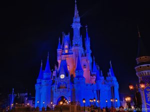 Cinderella Castle at Magic Kingdom lit up at night.