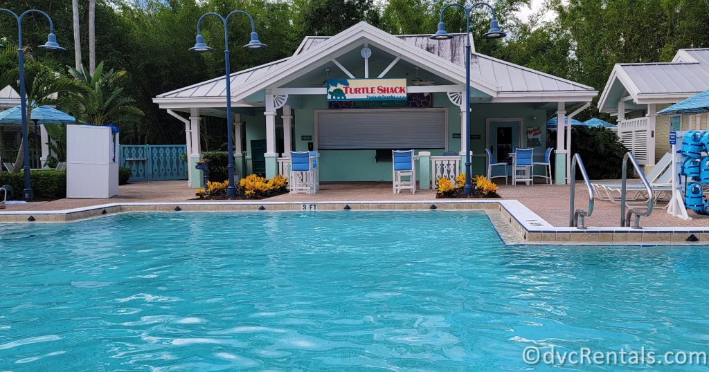 Turtle Pond Pool at Disney's Old Key West Resort with the Turtle Shack Poolside Snacks Shack in the background.