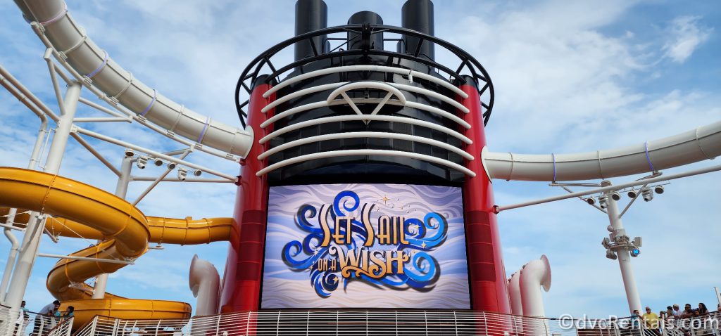 Smokestack onboard the Disney Wish. The screen on the side of the smokestack reads "Set Sail on a Wish."