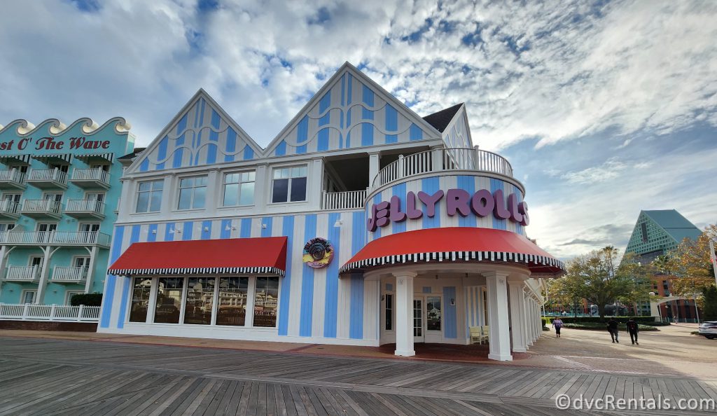 Exterior of Jellyrolls. White and blue striped building with purple letters that read "Jellyrolls."