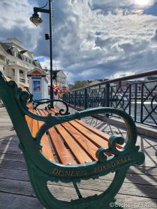 Side of a green bench that reads "Disney's Boardwalk" in gold.
