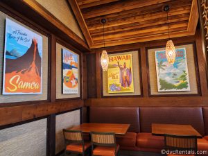 Graphic Posters of different Polynesian destinations hanging on the walls at Capt. Cook's.