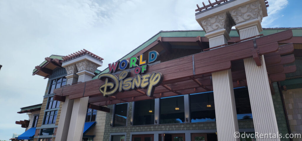 World of Disney Sign on the dark wood building.