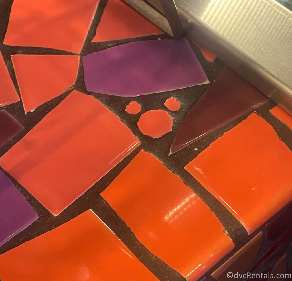 Hidden Mickey built into the colorful tile of a countertop.