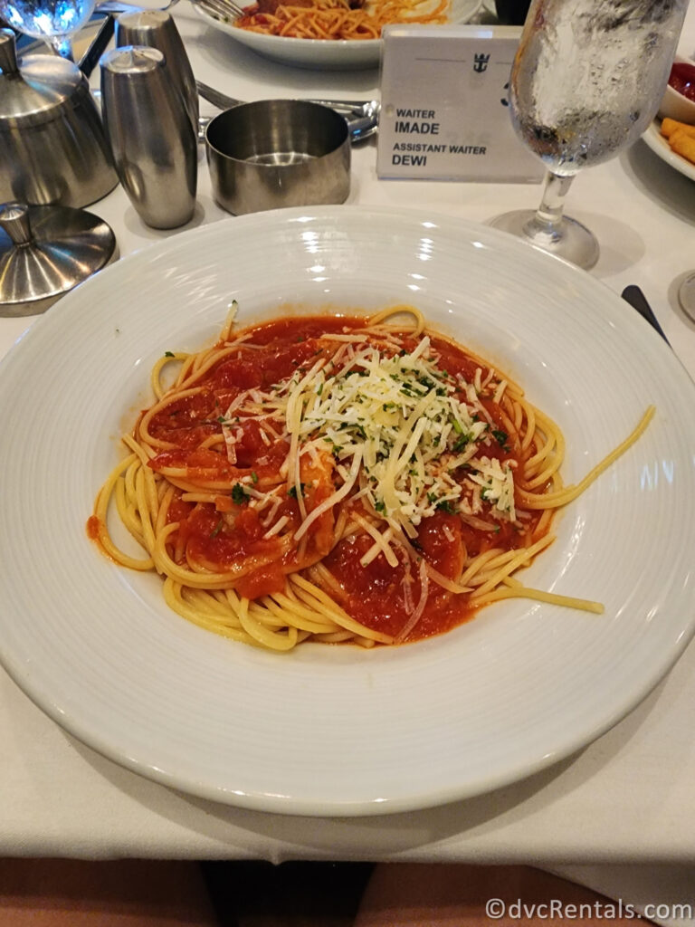 Spaghetti covered in tomato sauce served alongside the Chicken Parmesan.
