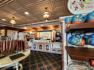 Merchandise in the Resort Gift Shop at Disney's Boardwalk Villas. There are multiple displays throughout the shop featuring bright souvenirs.