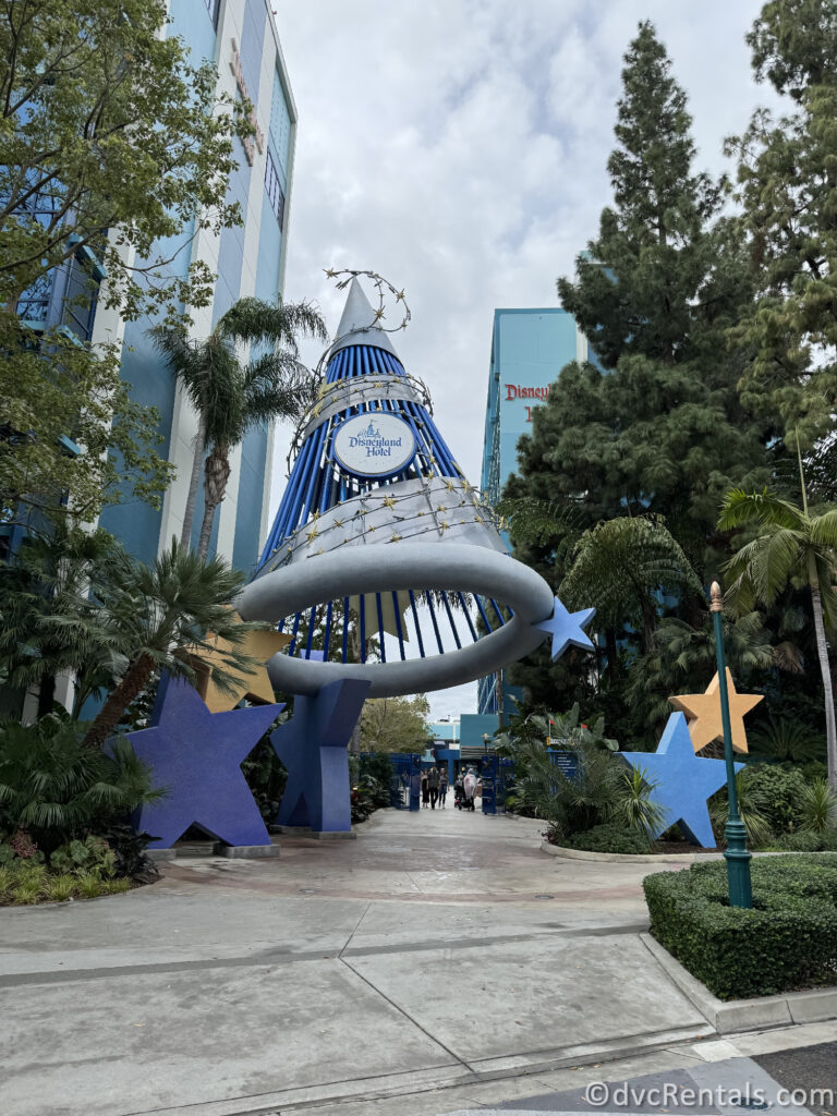 Large Metal Sorcerer Mickey Hat that reads "Disneyland Hotel" near the entrance of the Disneyland Hotel.