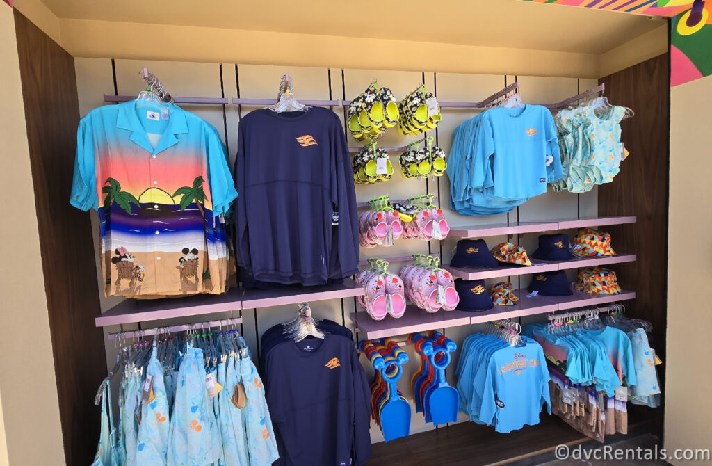 Multiple Disney Cruise Line merchandise options hanging on a wall.