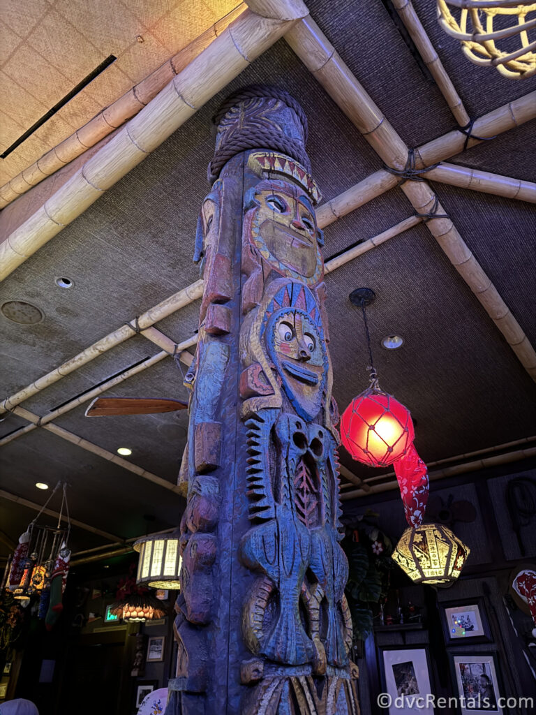 Tiki Wood Carvings on a wooden post inside Trader Sam's