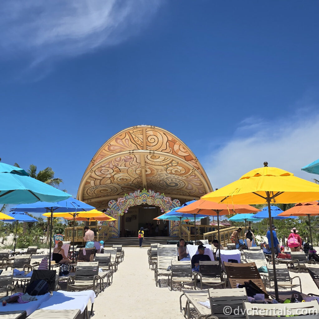 Beach Seating with colorful umbrellas sprawled along the white sand.