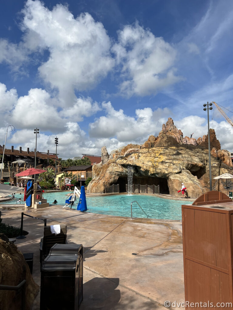 Volcano-shaped rock formation with a waterfall in the pool at Disney's Polynesian Villas.