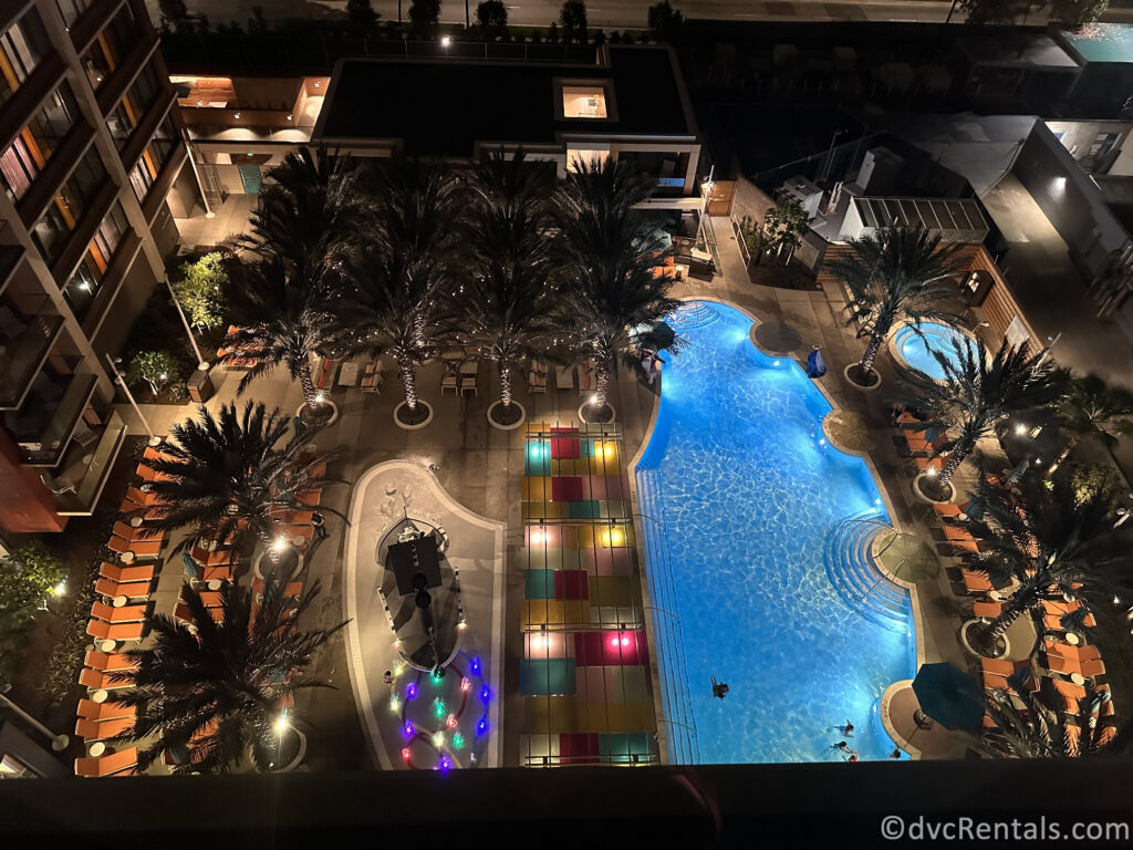 Villas at Disneyland Hotel Pool at night, shot from a room balcony overhead.