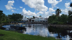 Back-side of the Hospitality House at Disney's Old Key West Resort. The water taxi is sailing on the water in front of the building.