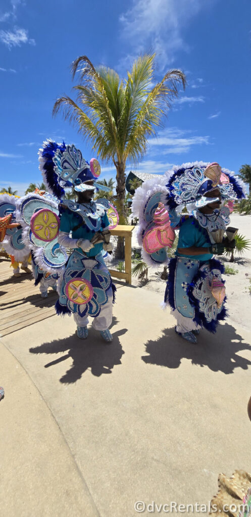 Performers in traditional Bahamian garb dancing in a parade throughout Lookout Cay.