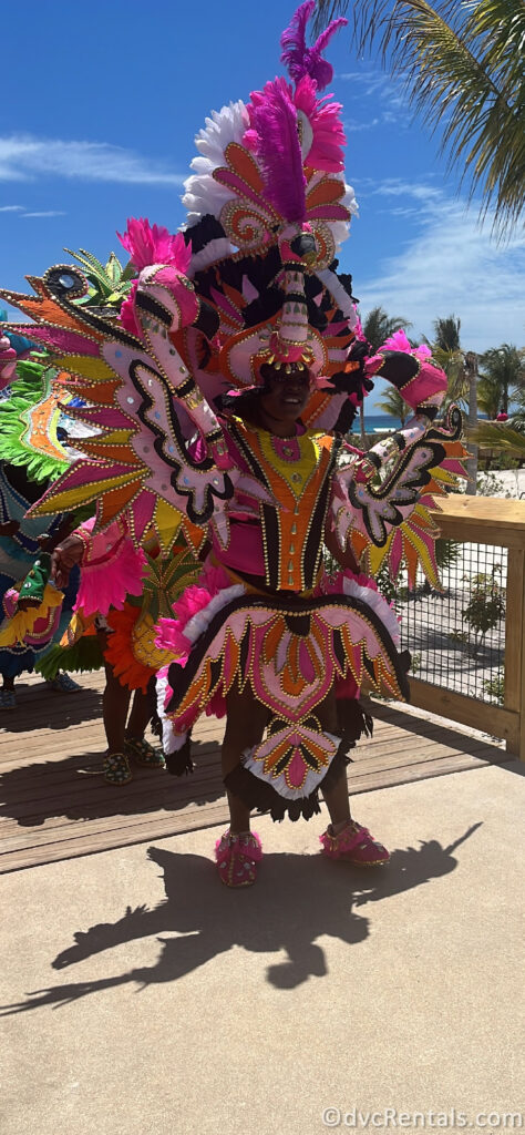 Performers in traditional Bahamian garb dancing in a parade throughout Lookout Cay.