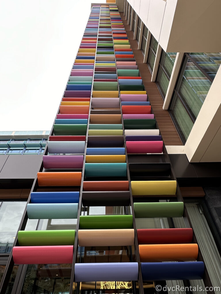 Colorful tiles sticking out of the side of the hotel.