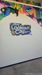 Wall with a blue sign that reads "Disney Lookout Cay at Lighthouse Point".