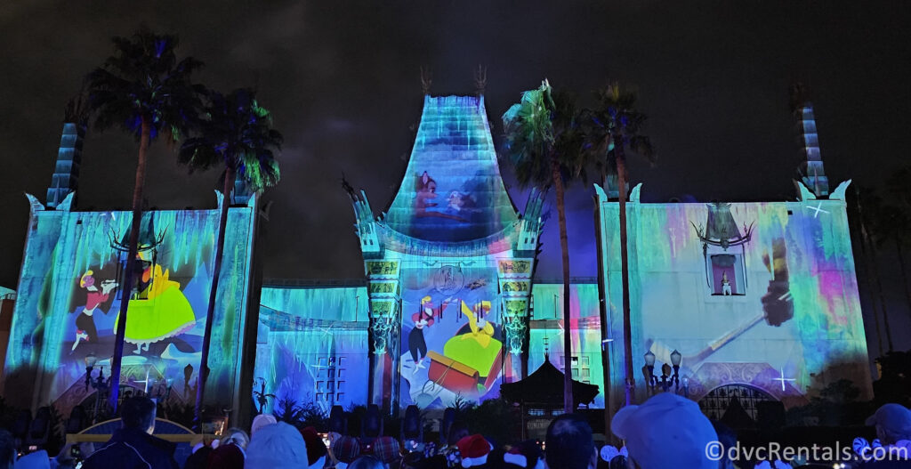 Projections lighting up the Chinese Theater in Hollywood Studios during the Jingle Bell Jingle Bam presentation.