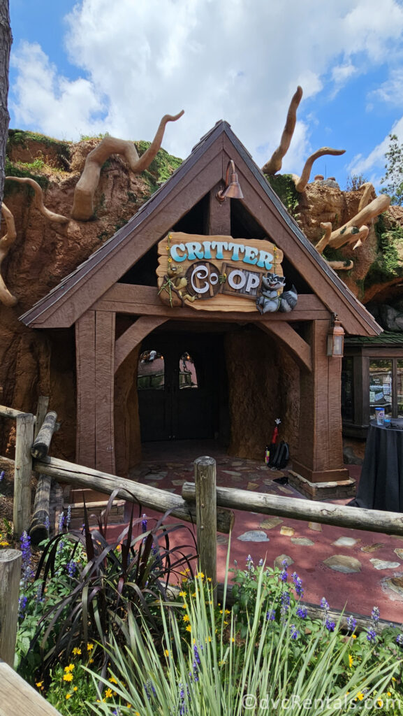 Exterior of Critter Co-op. The wooden entrance is built into a large rock.