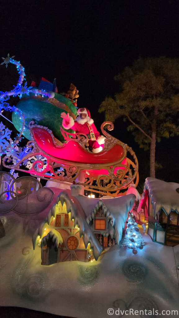 Santa Claus on a float in Mickey’s Once Upon a Christmas Parade at Magic Kingdom.