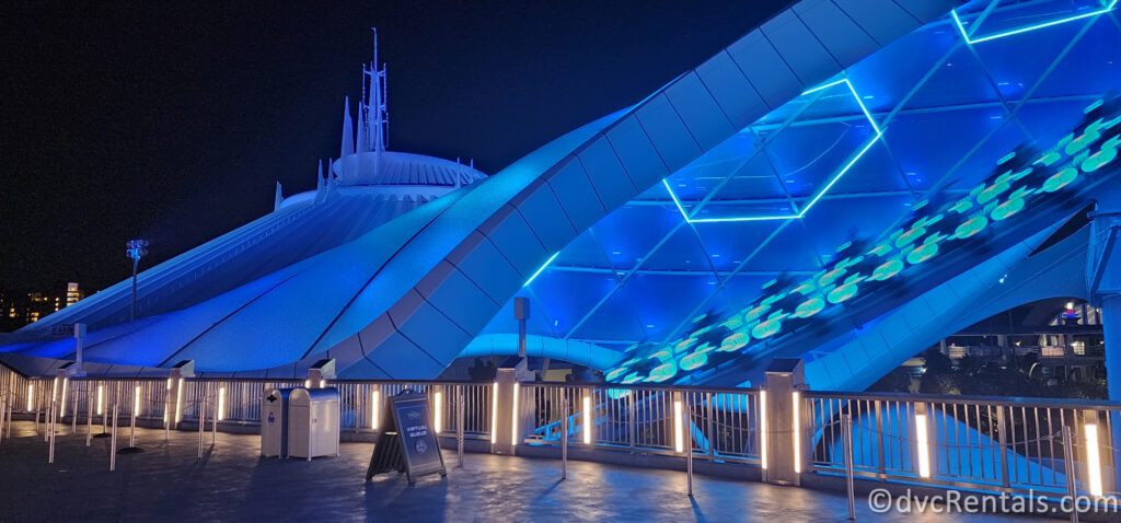 Covered Dome from Tron: Lightcycle/Run with the lightcycle riding past and Space Mountain in the background.