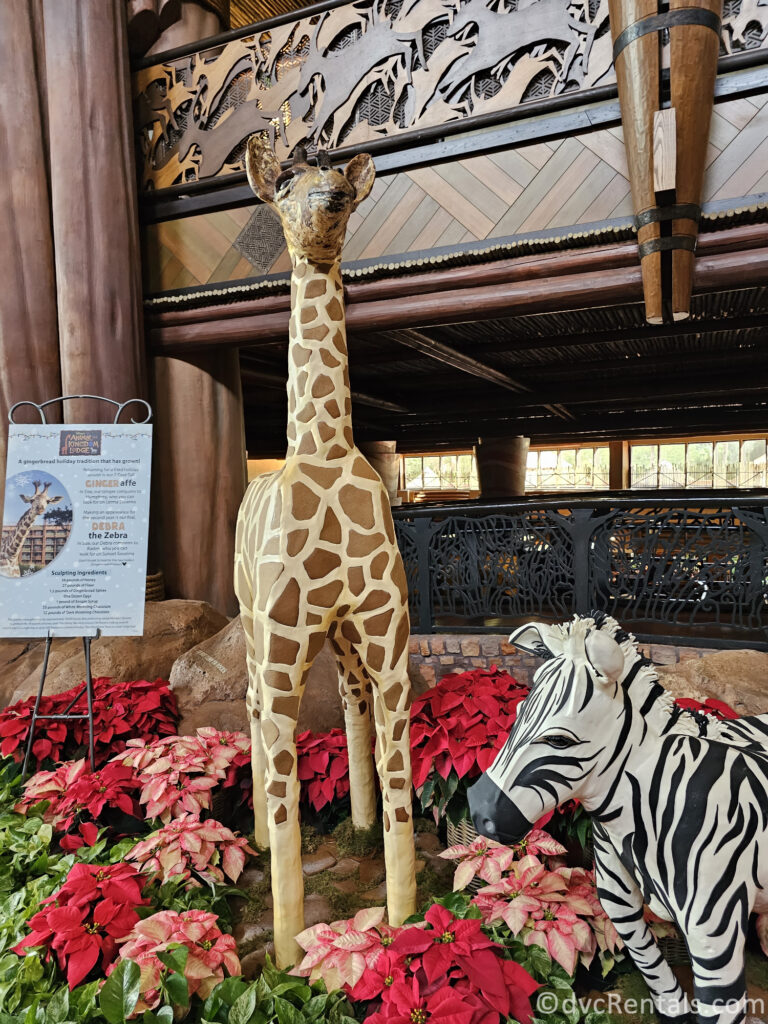 Gingerbread statues of a giraffe and a zebra in the lobby of Disney's Animal Kingdom Lodge.