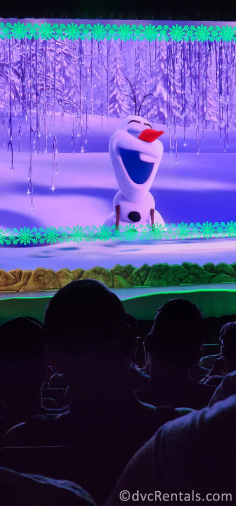 Olaf singing on screen at For the First Time in Forever: A Frozen Sing-Along Celebration.