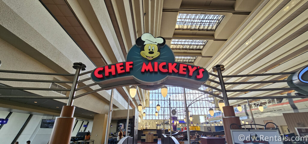 Chef Mickey's sign. There is a photo of Mickey Mouse in a chef's hat above the red lettering on the sign.