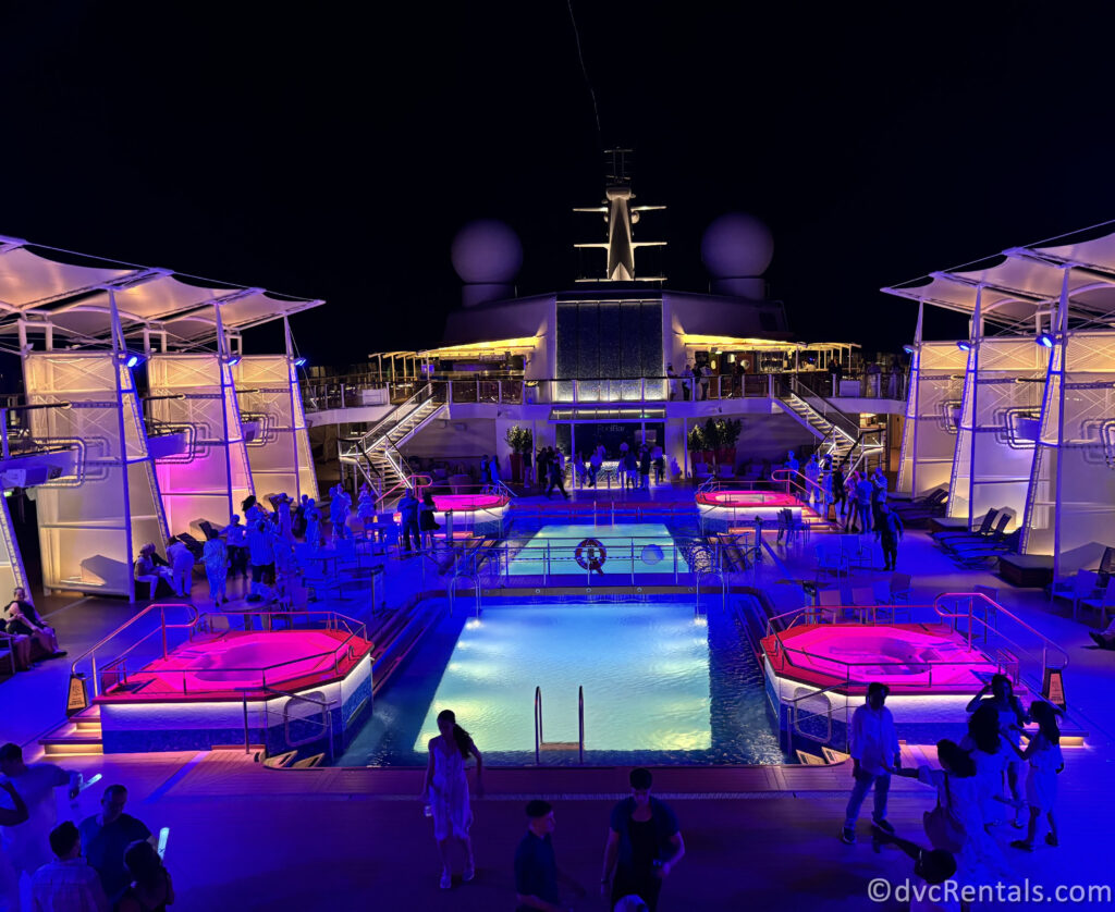 Pool deck onboard the Celebrity Reflection at night during the Deck Party.