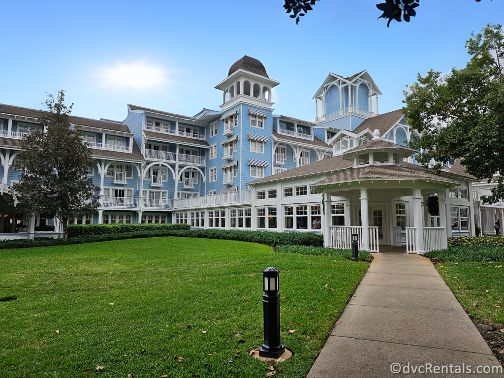 Front of Disney's Beach Club Resort. The resort is a large, blue building with a white gazebo in the foreground.