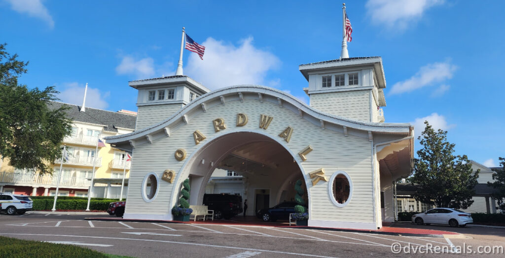 Entrance to Disney's Boardwalk Resort. The entrance features a large, arched structure with the word "BOARDWALK" written across it in gold letters.