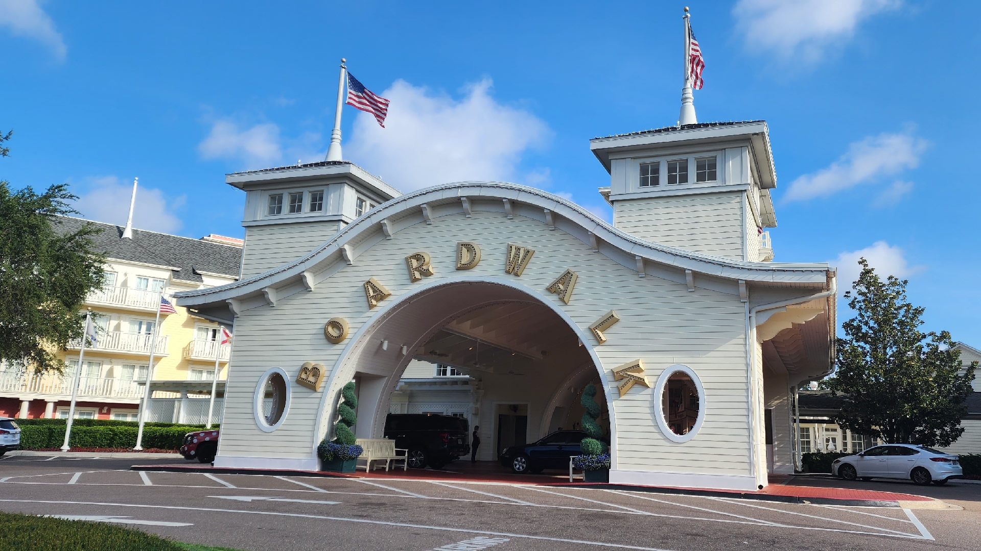 Entrance to Disney's Boardwalk Resort. The entrance features a large, arched structure with the word "BOARDWALK" written across it in gold letters.