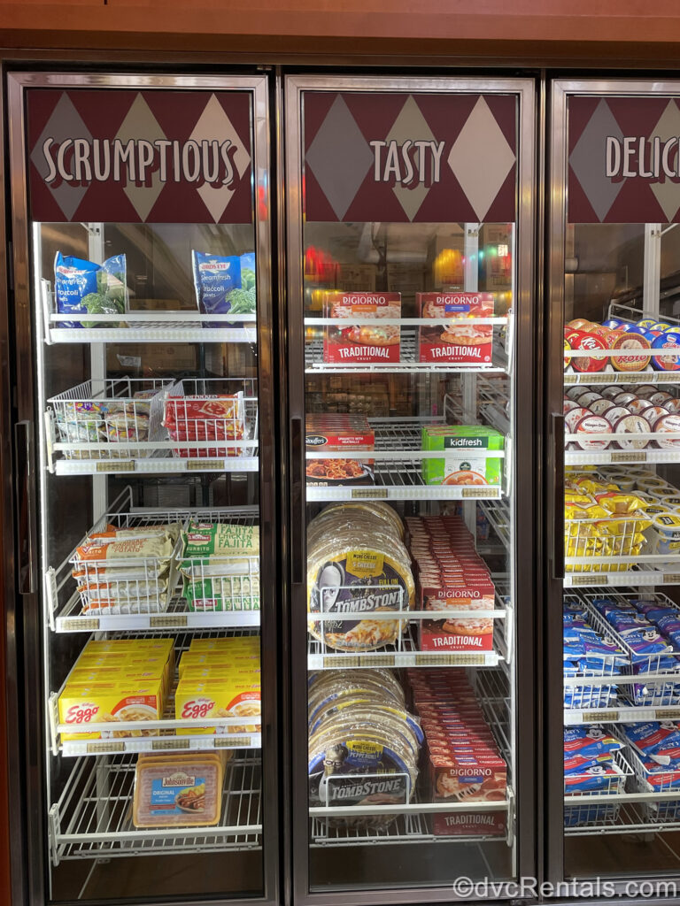 Frozen foods such as pizza, ice cream, vegetables, and Eggo waffles are displayed behind the glass freezer doors of the Grab-and-Go section of The Artist’s Palette at Disney’s Saratoga Springs Resort & Spa.