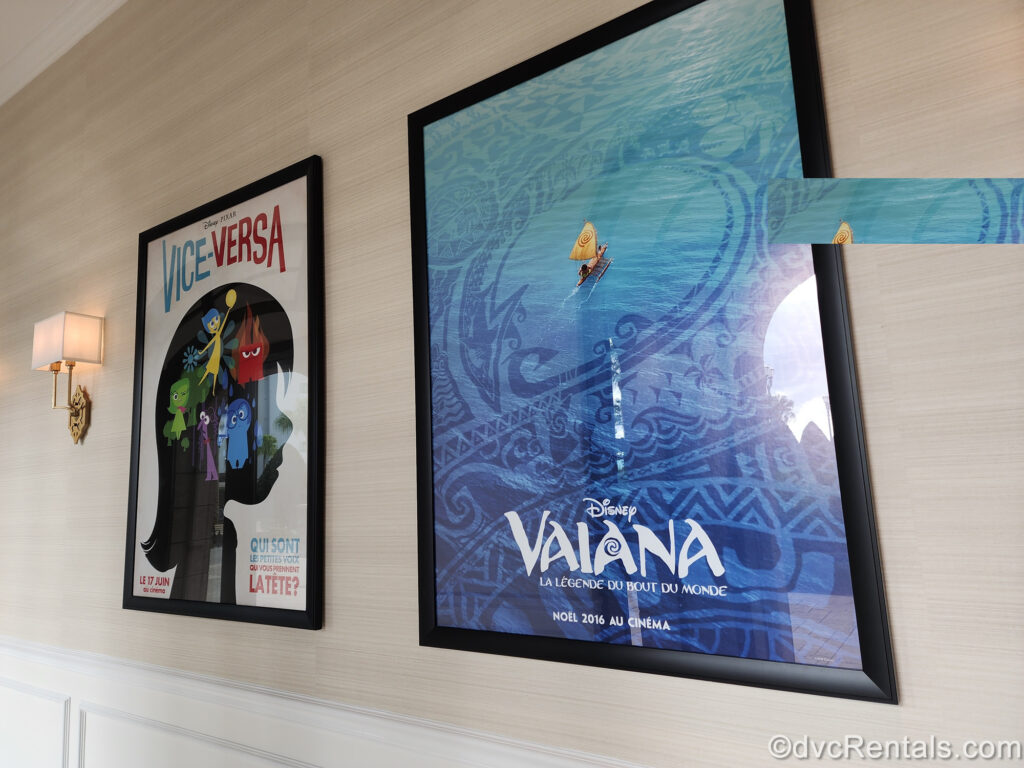 International movie posters for Moana and Inside Out are displayed in black frames at Disney’s Riviera Resort. The film titles and tag lines are in French on the posters.