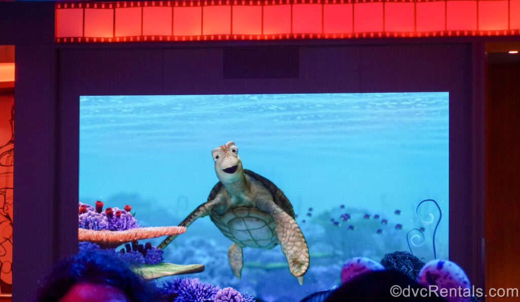 Crush from Disney’s Finding Nemo is seen chatting with guests in the Animator’s Palate dining room onboard the Disney Fantasy.
