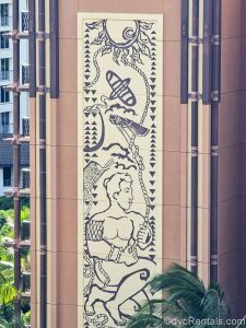 A large mural of Hawaiian art is seen displayed on an exterior portion of Aulani’s resort building.