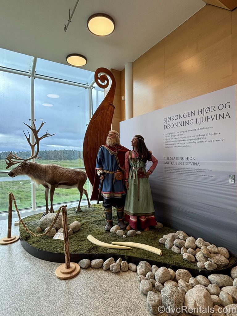 A display at the Nordvegan History Centre in Avaldnes, Norway features mannequins dressed in historical garb as well as the end of a Viking longship and a stuffed reindeer.