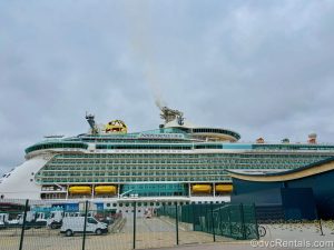 The exterior of Royal Caribbean’s Independence of the Seas is seen from the Cruise Terminal in Southampton, England under a cloudy sky.