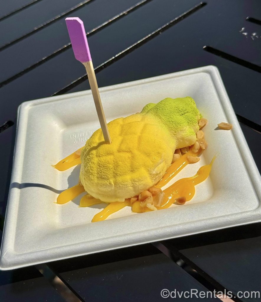 Gluten-Free Pineapple Cheesecake with Passion Fruit Curd and Macadamia Nuts.