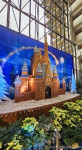 A large gingerbread version of Cinderella Castle is displayed in a wintery scene at Disney’s Contemporary Resort.