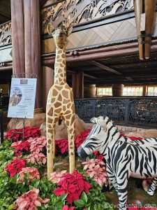 A display showcasing a zebra and giraffe made of gingerbread is seen in the lobby of Disney’s Animal Kingdom Villas Jambo House.