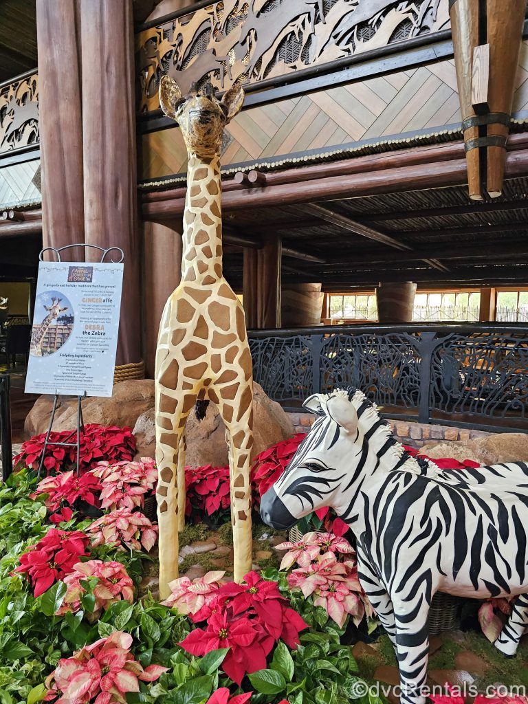 A display showcasing a zebra and giraffe made of gingerbread is seen in the lobby of Disney’s Animal Kingdom Villas Jambo House.