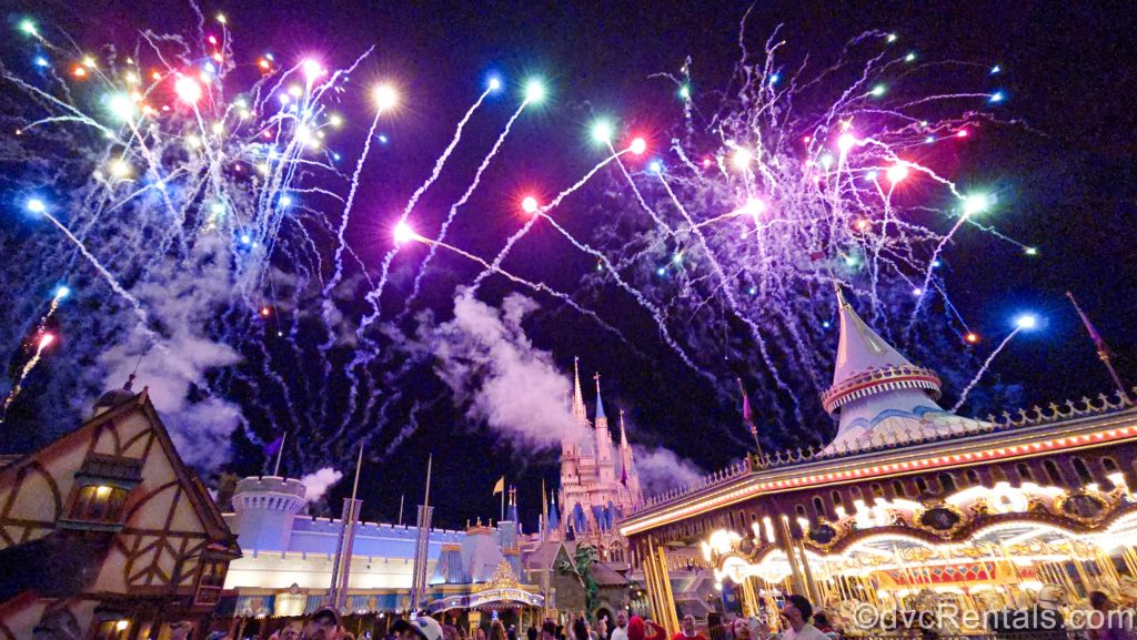 Colorful fireworks fill the sky over Fantasyland and Cinderella Castle at the Magic Kingdom during the Happily Ever After nighttime show.